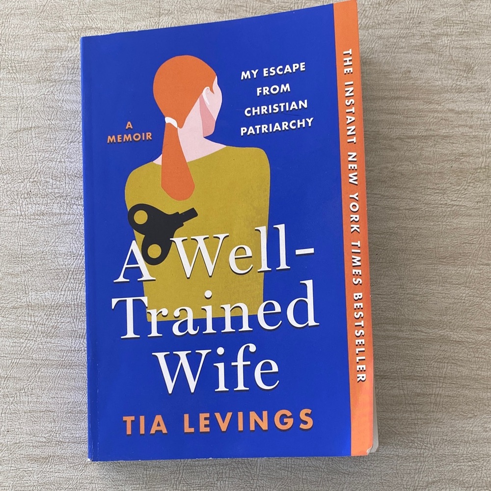 A WELL-TRAINED WIFE Paperback Book by Tia Levings